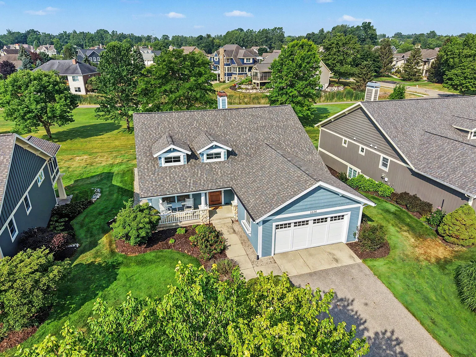 Aerial of a ranch home on a golf course, from an EZ Shots shoot